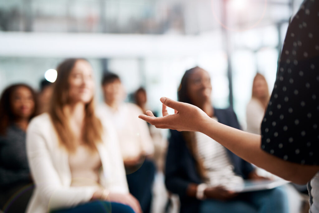 Cropped shot of a businesswoman delivering a speech during a conference