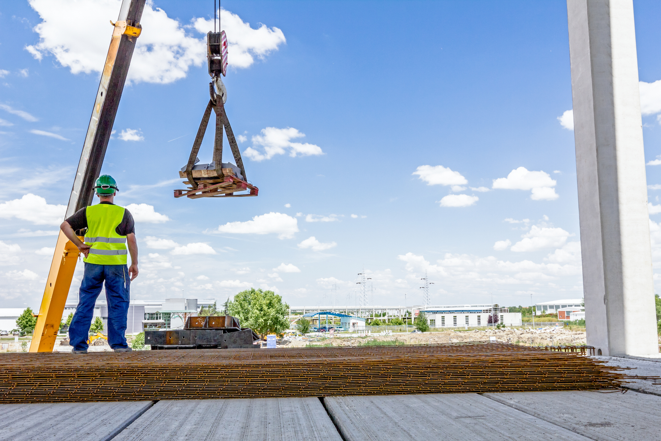 mobile crane is lifting cargo on pallet