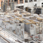 construction of apartment buildings, dense urban development. the process of construction of residential buildings.