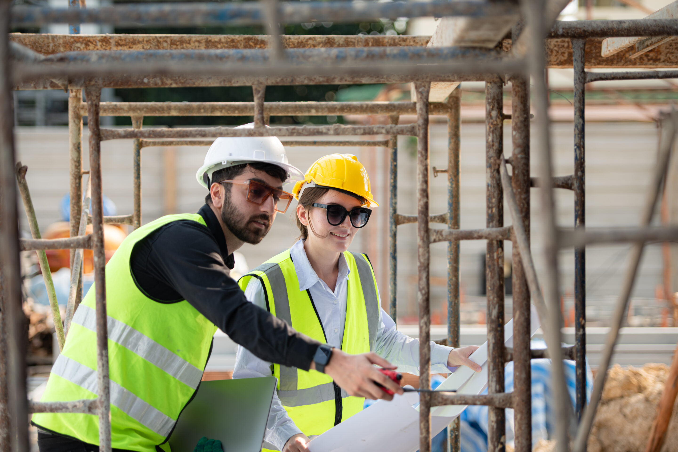 engineer and architect working on the construction site, double