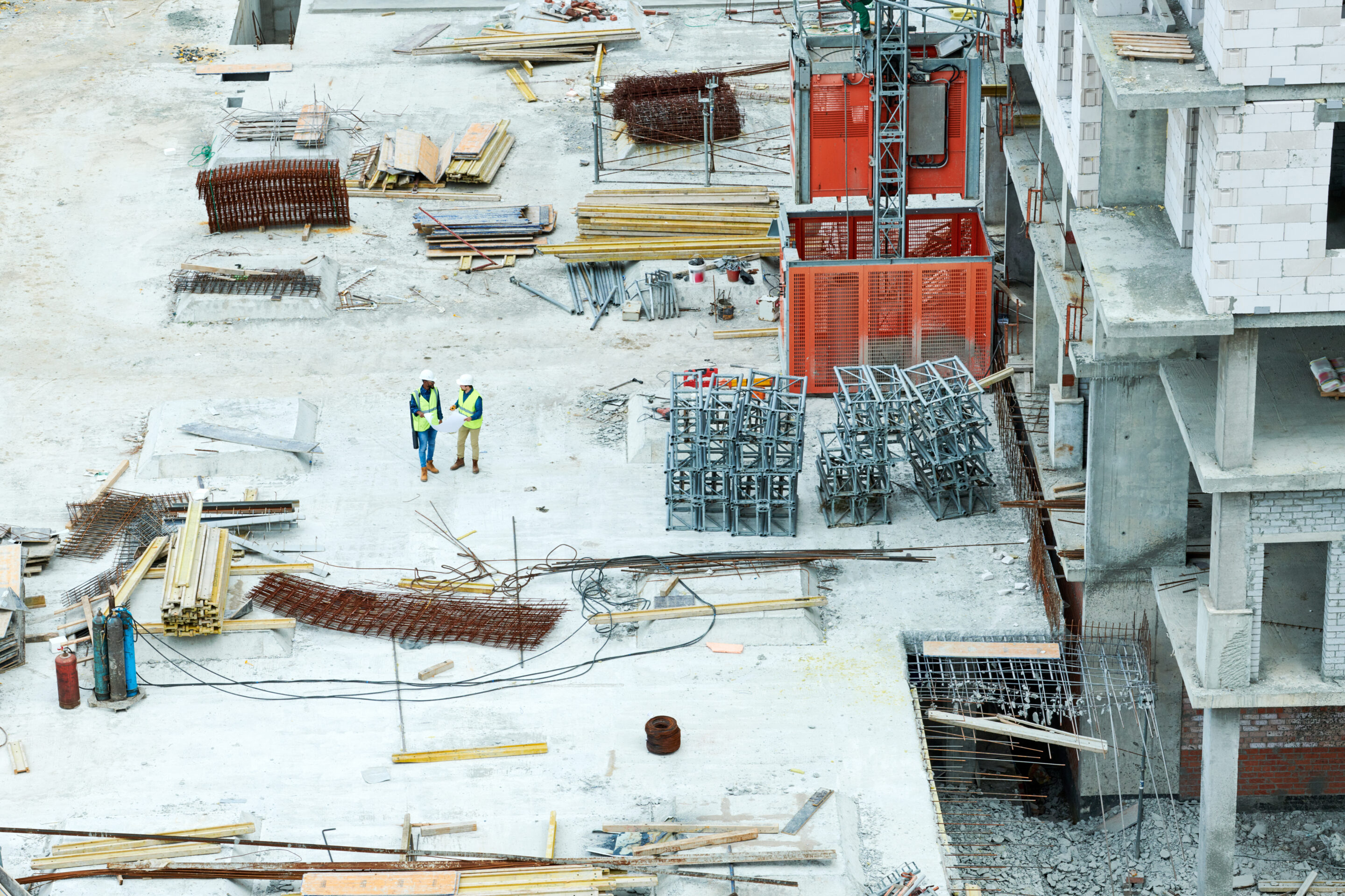 modern construction site with stacks of building materials