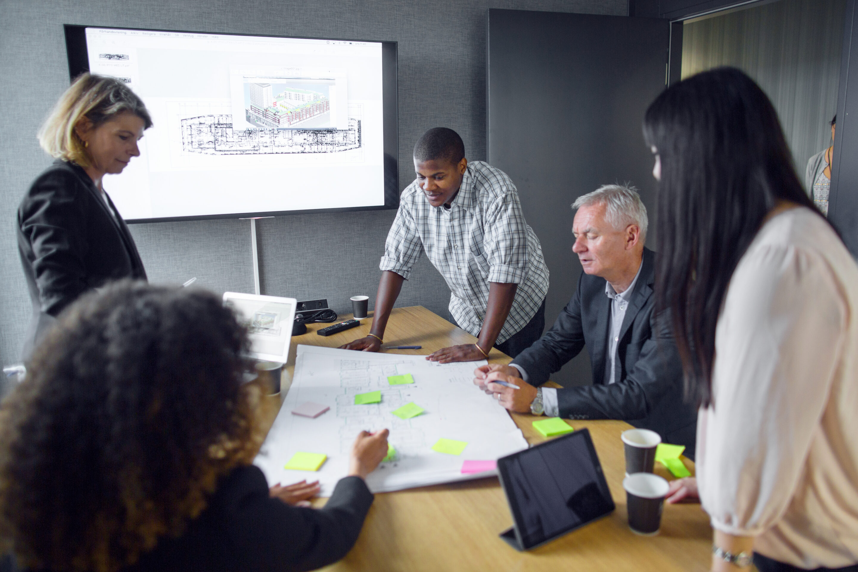 architects discussing blueprint in office