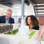 architects looking at model in office