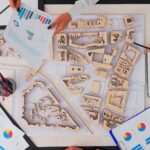 architects with buildings prototype working at office table