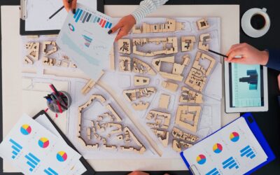 architects with buildings prototype working at office table