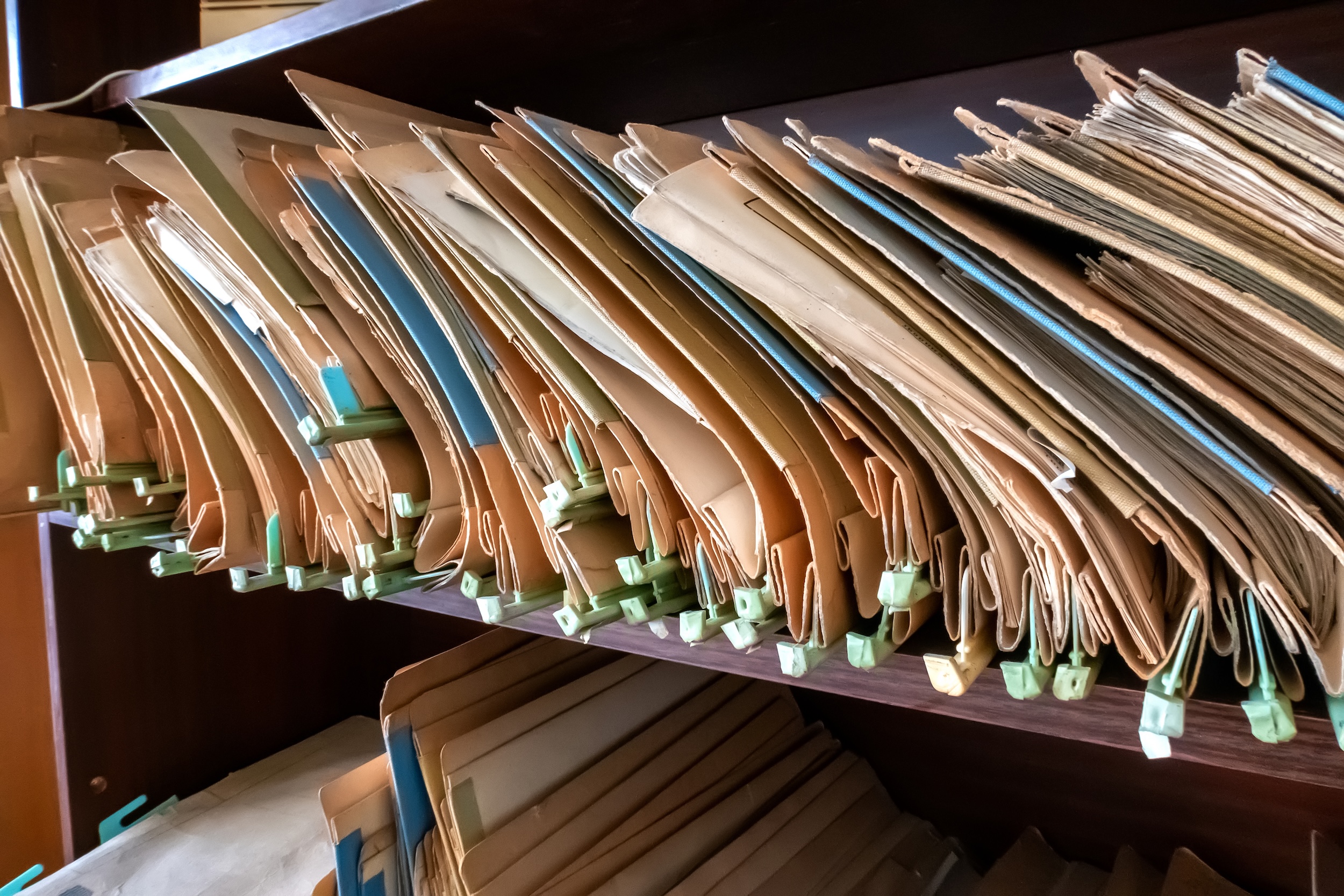 old folders with documents in the library.