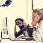 people thinking about to fix something on computer